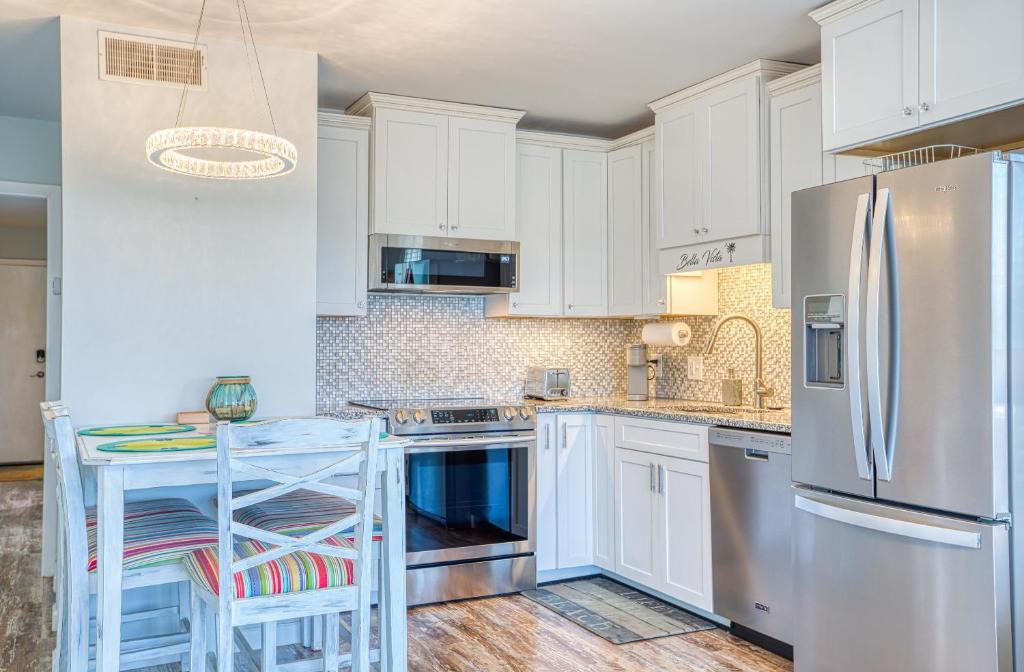 Garden City Apartment | Bella Vista: Marshfront Condo 1 Block To The Beach. Pool & Hot Tub-1st Floor