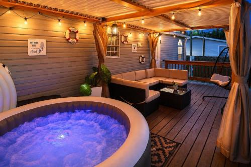 Iona House | Book A Paradise with Jacuzzi, BBQ & Paddleboards