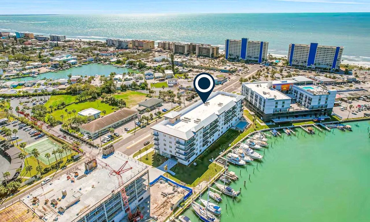 Madeira Beach Condo | Brand new condo steps to beach with balcony heated pool and hot tub dog friendly