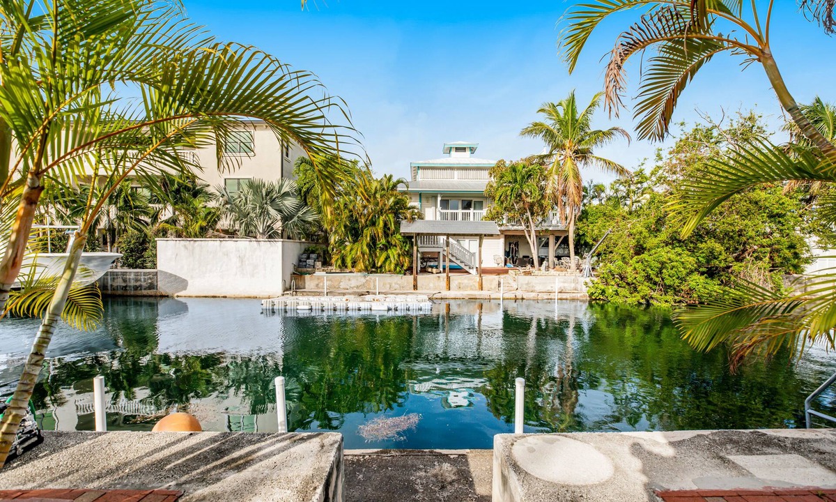 Big Coppitt Key House | Canalside condo with private dock, boat ramp, water-view patio, central AC & W/D