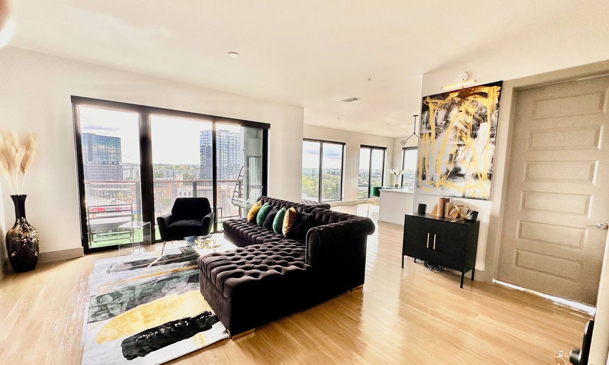 Home Park Apartment | Ceiling to floor windows featuring a private balcony with stunning city views!