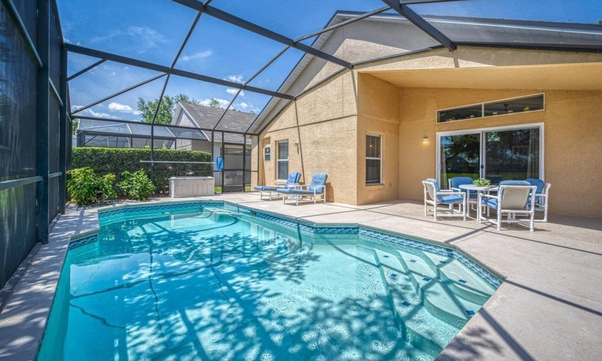 Kissimmee Villa | Charming 3BR home in Kissimmee with private pool and lake view, perfect for families.