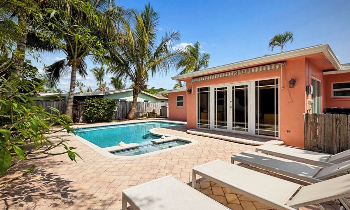 Tropic Palms House | Coastal retreat with heated saltwater pool & spa in prime Delray Beach.
