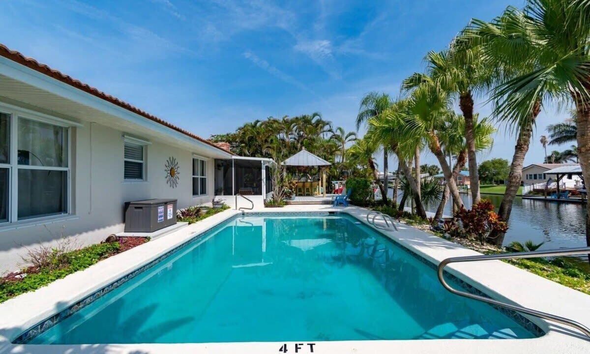 Cocoa Isles House | Cocoa Beach Waterfront Home with Tiki Bar and Pool
