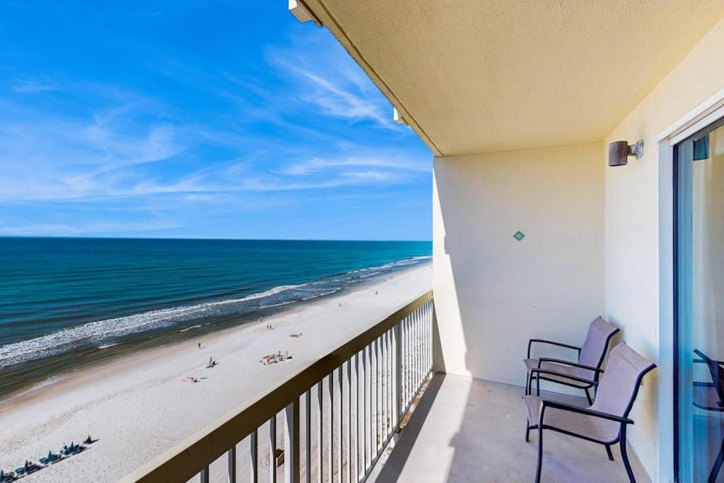 Miramar Beach House | Colorful oceanfront condo with Gulf views on-site pools & hot tub