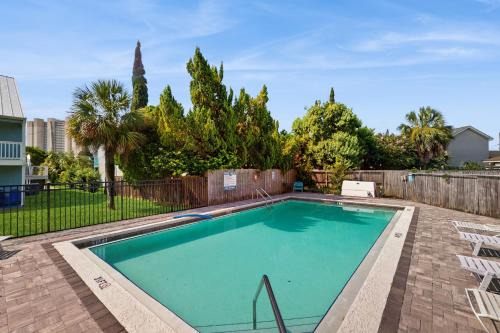 El Centro Beach House | Cozy coastal condo with a loft shared pool and beach access