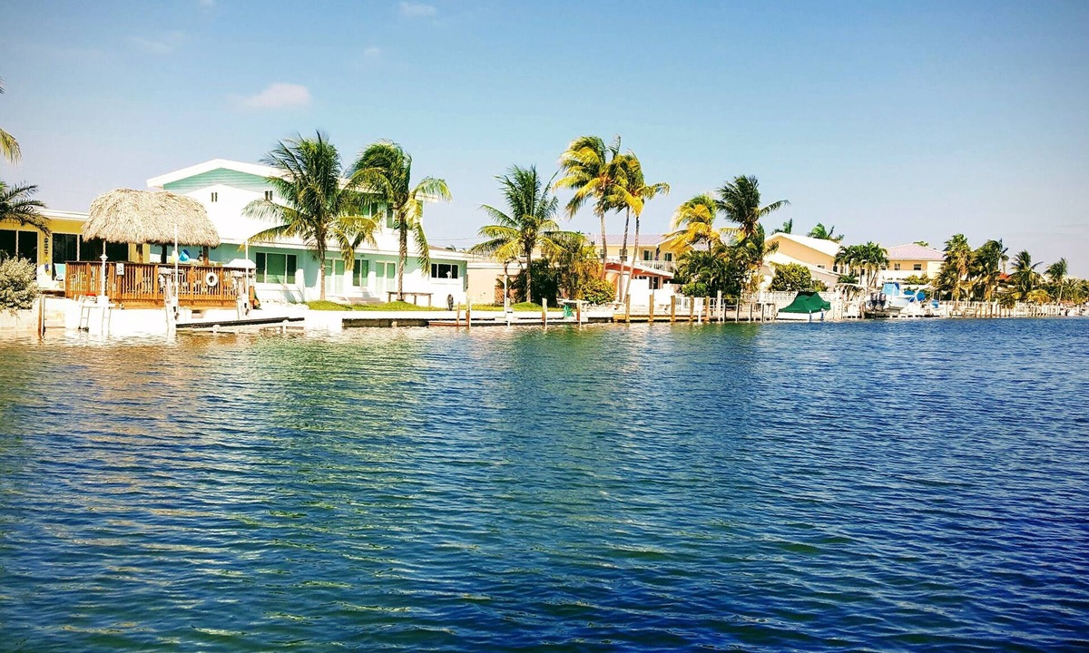 Key Colony Beach House | Dog-Friendly Waterfront House with 37ft Dock and Cabana Beach Club & Pool