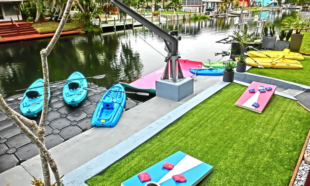 Weeki Wachee Gardens House | Family-Friendly Riverfront Home w/Game Room, Kayaks, Swim Mat & Space to Play