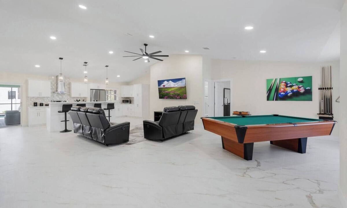 Mariner House | Home with heated pool and a pool table in Cape Coral