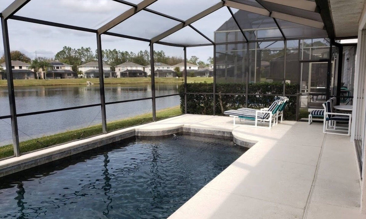 West Kissimmee Villa | Luxury villa Near Disney Gated Lake View Heated Pool w/sunset & home office