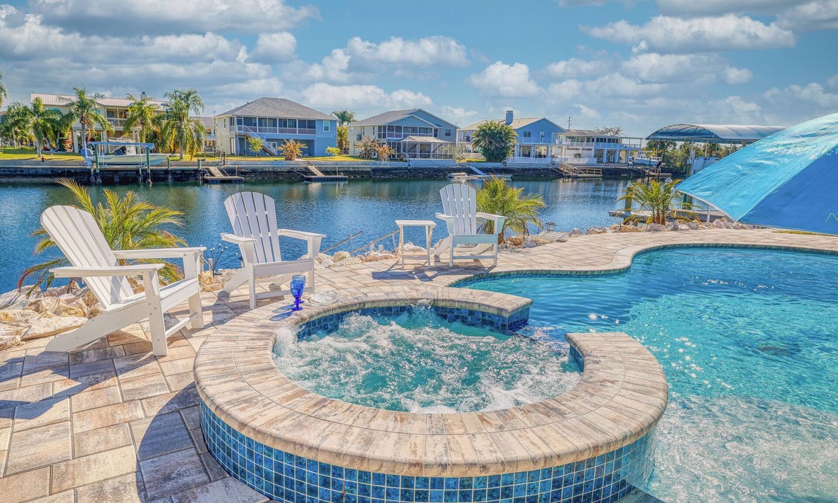 Spring Hill House | NEW! Waterfront Gulf Retreat w/Heated Pool, Spa, & Mini Golf.