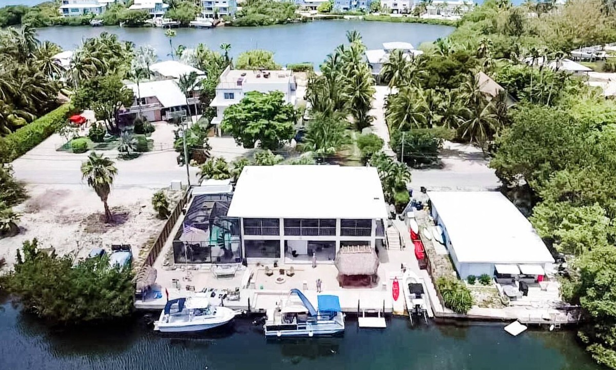 Pirates Cove House | Private waterfront resort, screened pool, hot tub, 90' dock, immaculate home.