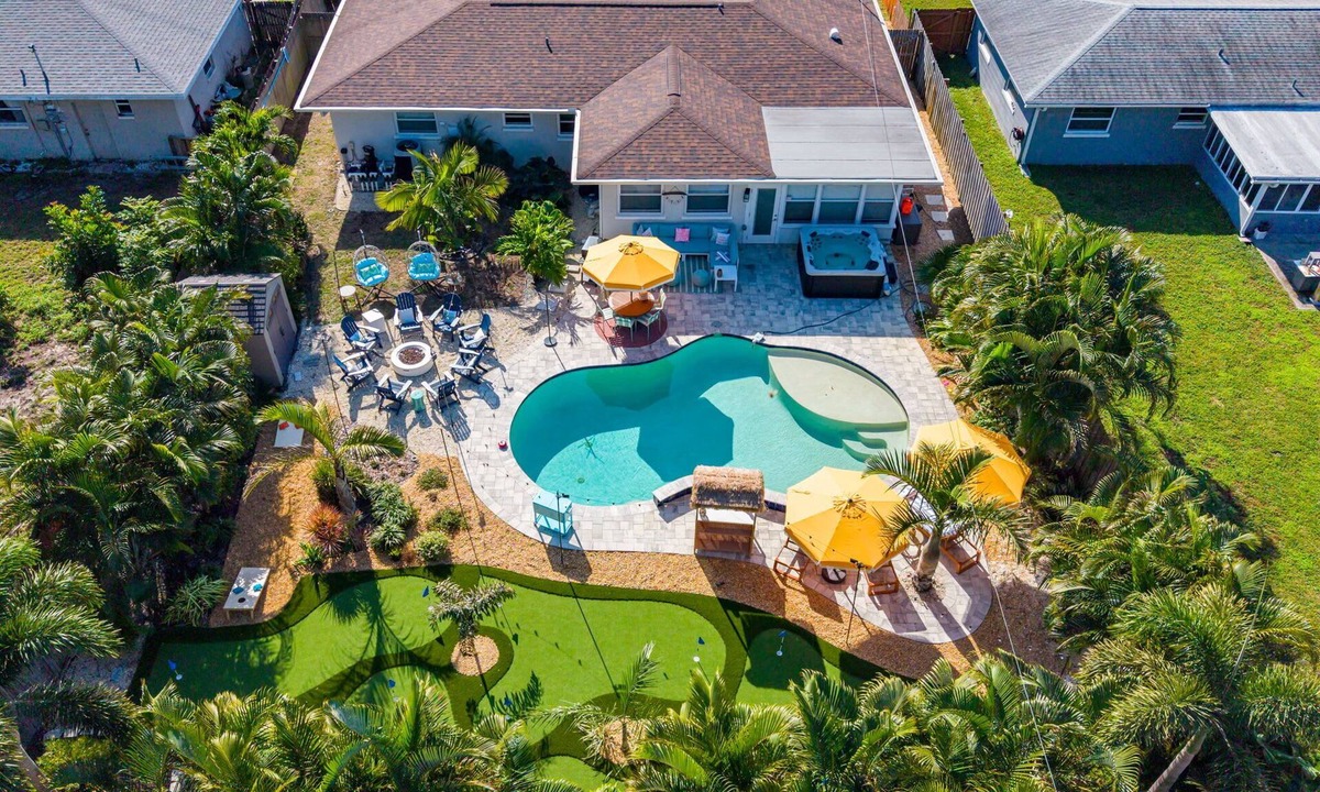 Seminole House | Resort Style Backyard Pool Hot Tub Movie Room
