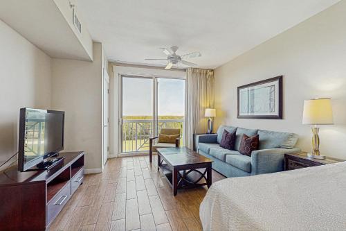 Baytowne Wharf Apartment | Stylish suite with a shared pool hot tub and golf course bay views