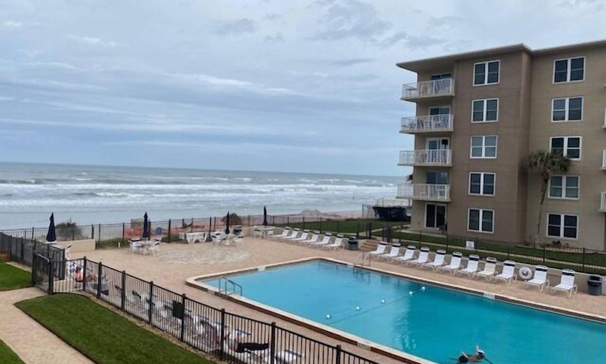 New Smyrna Beach Condo | Sunrise view over the ocean in this direct ocean front complex!
