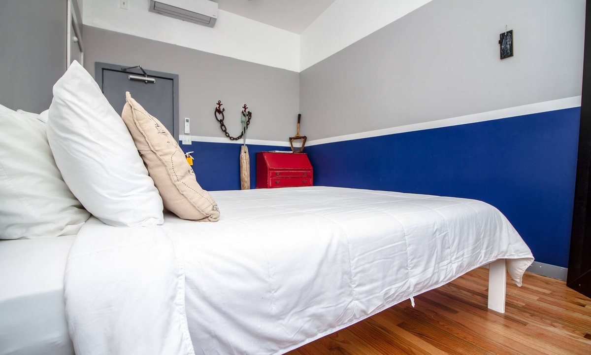 Queens Condo | The High Tide Two Bedroom Suite #8 Hotel Room by RedAwning