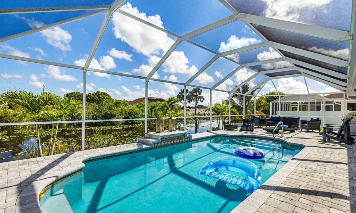 Mariner House | Tropical Gem! Sparkling Saltwater Pool Peaceful Canal with Dock Luxe Comfort
