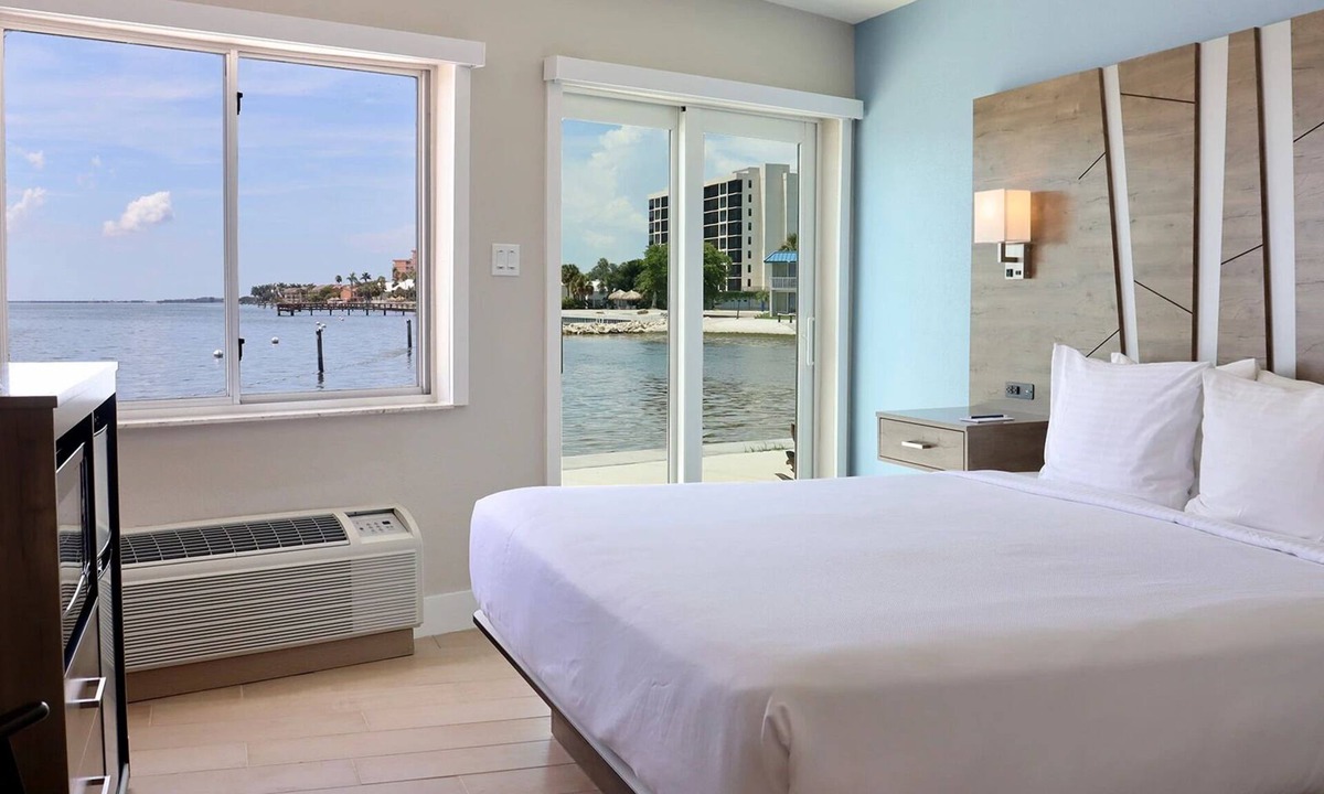Pinellas Point House | Tropical Retreat: Outdoor Pools, Private Beach, Waterfront Dining