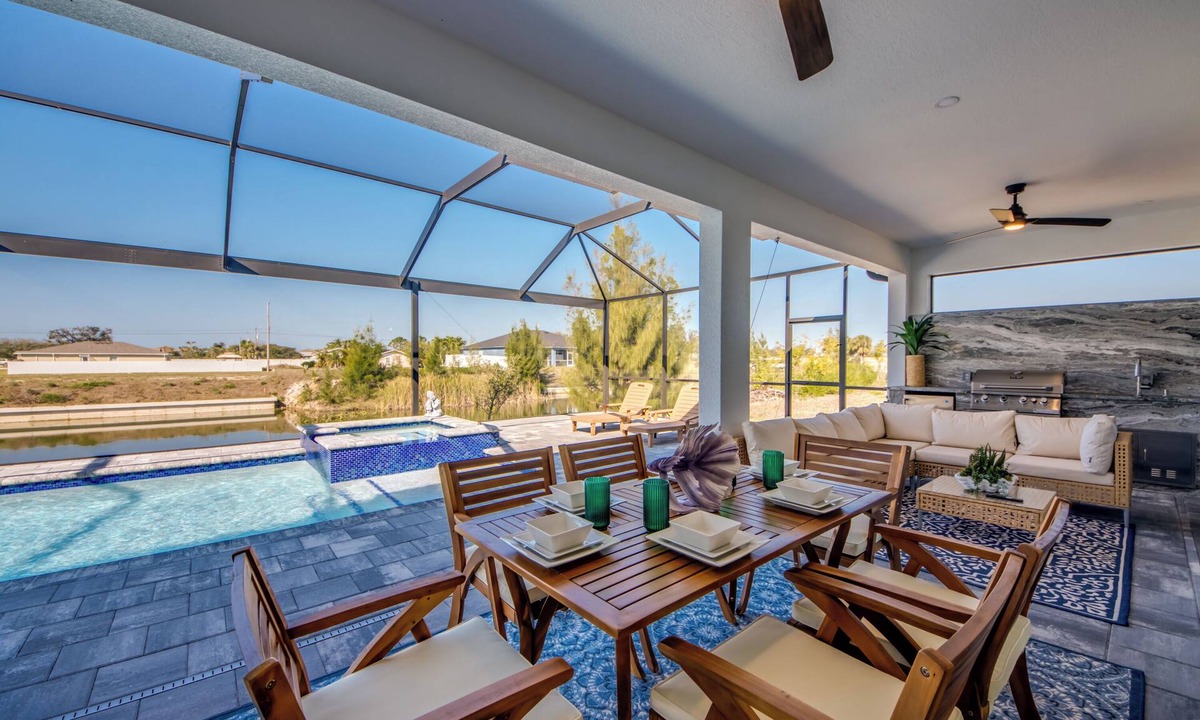 Pelican Villa | Villa Coral Bliss - Awesome 4 BR/3 bath waterfront villa w. heated pool, hot tub, kayaks, fishing poles, bikes