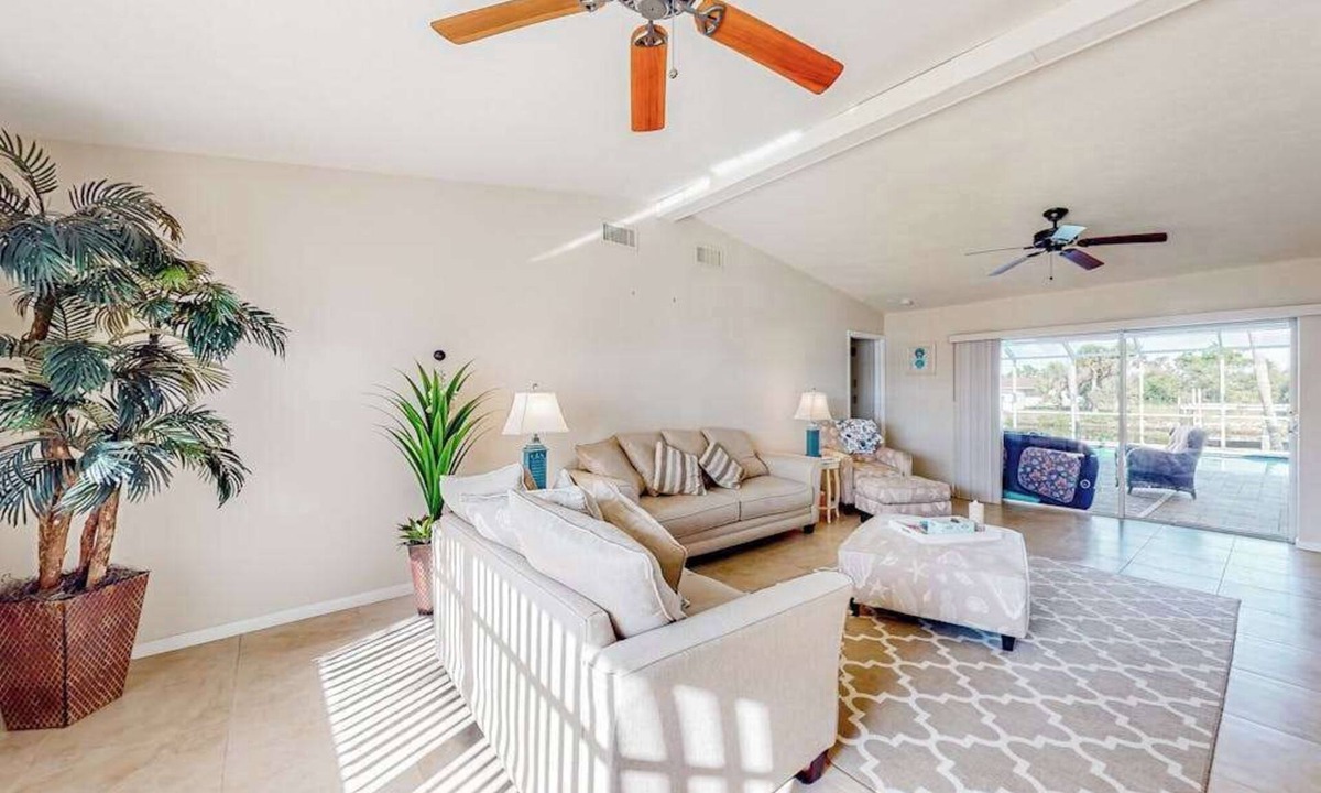 Gulf Cove House | Waterfront home with an enclosed pool, outdoor kitchen, and grill - dog-friendly