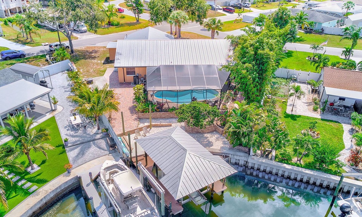 Apollo Beach House | Waterfront Oasis w/screened Lanai & Pool, Private Dock + Kayaks 3BR/2BA