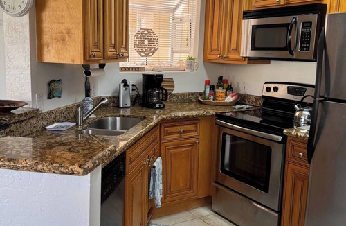Ocean Side Village Condo | 1-bedroom condo in tranquil Indialantic with pond view, pool and 5 min to beach
