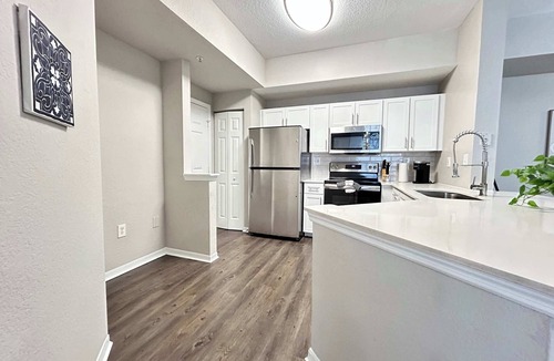 Westchase Apartment | 2 BR with Private Garage, Boutique Shops & Pond Views
