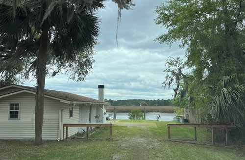 Midway Cottage | 3-bedroom waterfront cottage with deep water dock house and 60 ft. floating dock