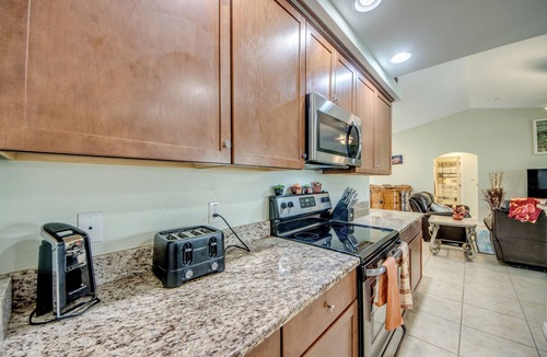 Trafalgar House | 4 Bedroom Fresh Water Canal Home with Saltwater Pool and Hot Tub!