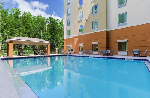 Florida Central Atlantic Coast Apartment | 4 Bright Double Queen Studios | Kitchens & Pool | 2.4 mi to Disney Springs