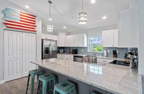 Pine Valley House | ALL the amenities! 3bd 2 bath with hot tub, on canal, dock, pool heat included!
