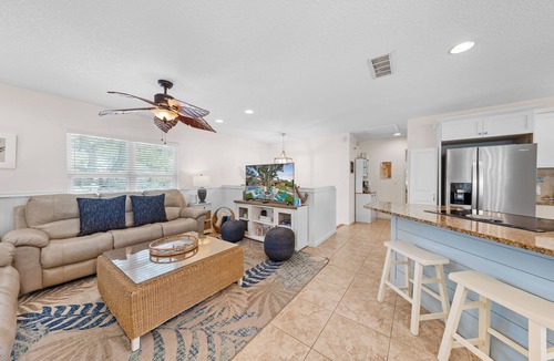 Butler Beach House | Backyard Paradise/Pool, Fire Pit, Games, & Kayaks on Canal Front near Beach