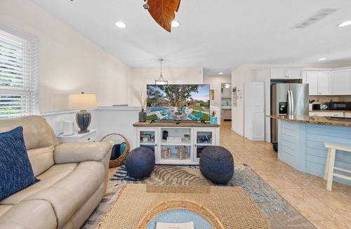 Butler Beach House | Backyard Paradise/Pool, Fire Pit, Games, & Kayaks on Canal Front near Beach