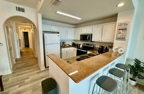 Florida Central Atlantic Coast Apartment | Balcony Lake Views | Pool, Gym, WiFi & Parking