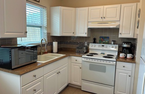 Daytona Beach Shores House | BEACH LIFE! 2 BR 1 BA HOUSE. PARKING/GARAGE. Steps to the BEACH! PET FRIENDLY!