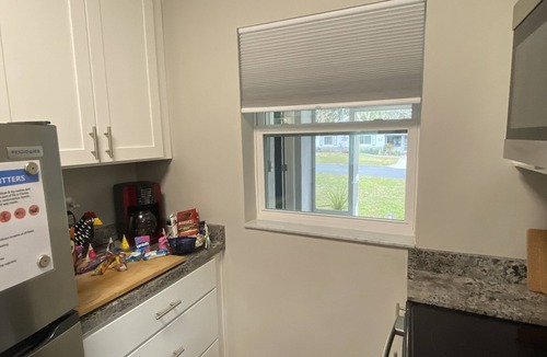 Ocala House | Beat the heat in two screened patios!