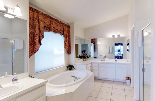 Sabal Harbour House | Beautiful Waterside Home with a Private Pool, Spa, and Lake Views