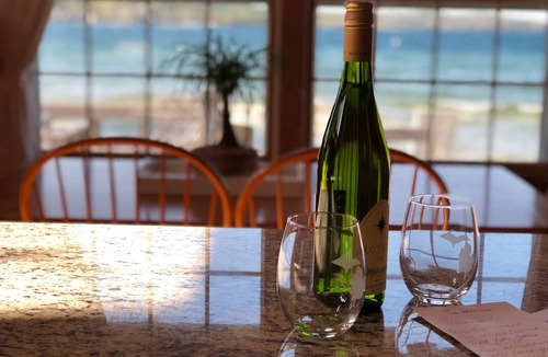 Suttons Bay House | Big Sandy Beach !Walk to Village! Suttons Bay Waterfront Cottage.