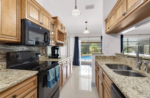 Brandon House | Blue Serenity Retreat - Come relax by the heated pool and jacuzzi!