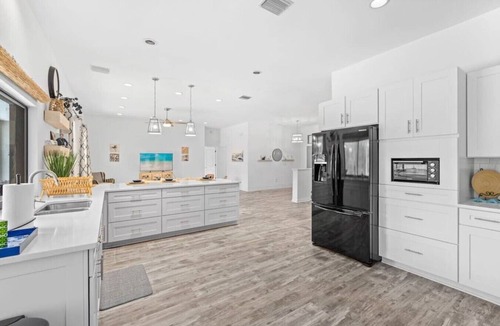 Palma Sola House | Bradenton Canal Home w/Private Pool, Hot Tub, Pac-Man Arcade & Canal Fishing