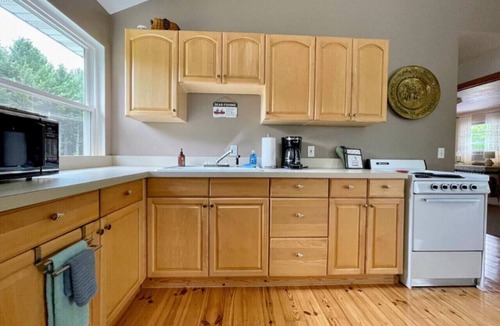Grawn House | Brookside Cottages and Resort The Big House