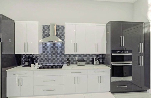 Trafalgar House | Canal front home with saltwater pool, hot tub, and washer and dryer.