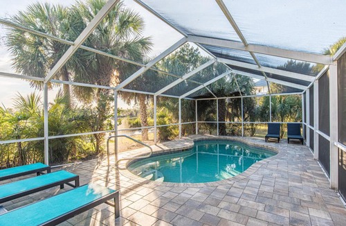 Woods N Waters House | Canal home with pool, kayaks, private dock, firepit sleeps 9