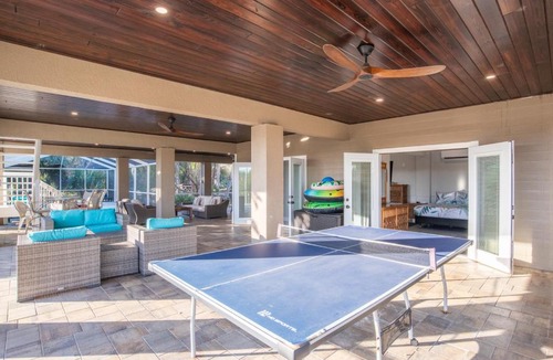 Woods N Waters House | Canal home with pool, kayaks, private dock, firepit sleeps 9