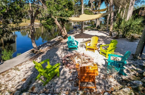 Woods N Waters House | Canal home with pool, kayaks, private dock, firepit sleeps 9