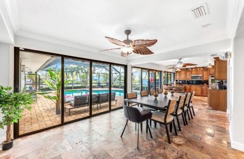 Cocoa Isles Villa | Casa De Olas - Waterfront Luxe Home - Heated Pool - Game Room - Boat Lift - Minutes to Beach