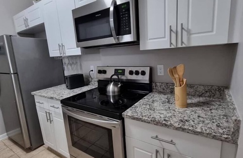 Windsor Palms Condo | CasaComfort near Disney-King Suite bedroom, FREE Amenities, and great location.