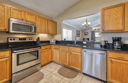 Kissimmee Villa | Charming 3BR home in Kissimmee with private pool and lake view, perfect for families.