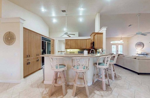 Englewood House | Charming beachside duplex steps to the Gulf with bikes and coastal views