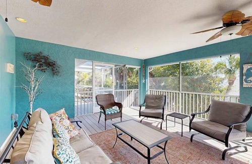 Englewood House | Charming beachside duplex steps to the Gulf with bikes and coastal views